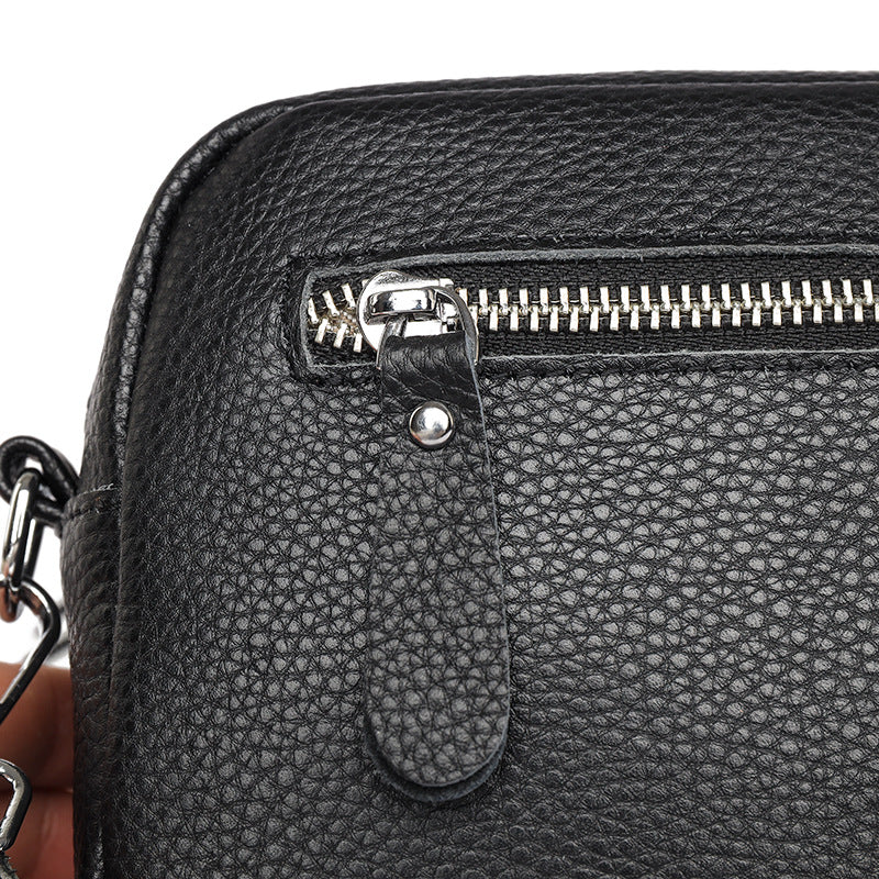 Small leather crossbody bag with patterned strap