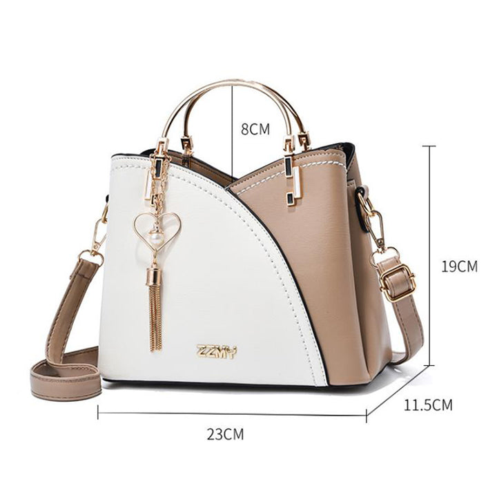 Colour block handbag with heart tassel