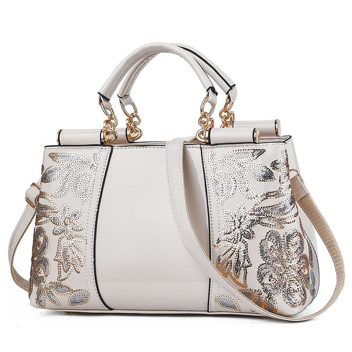 Sequin embroidered patent evening handbag