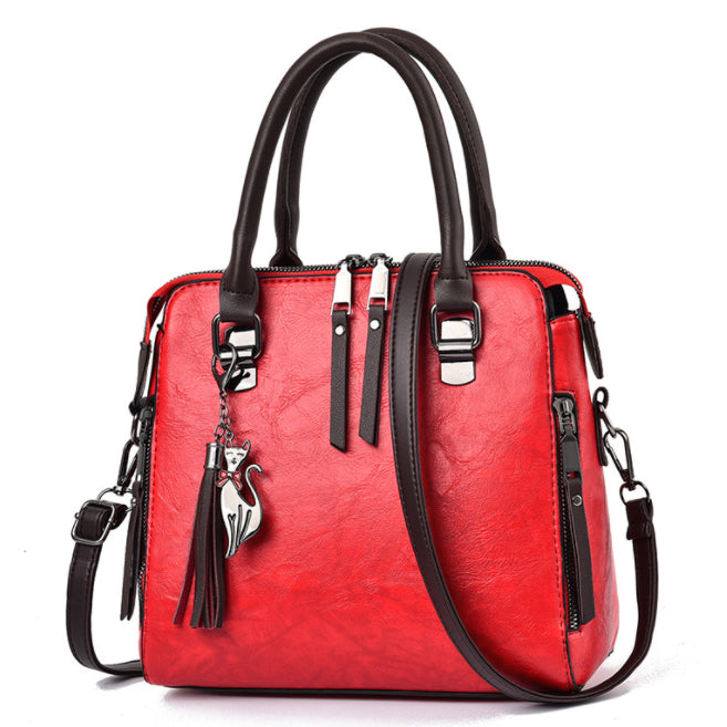 Vintage faux leather handbag with tassel
