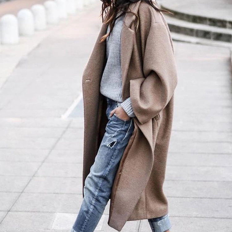 Woman wearing long oversized lapel coat