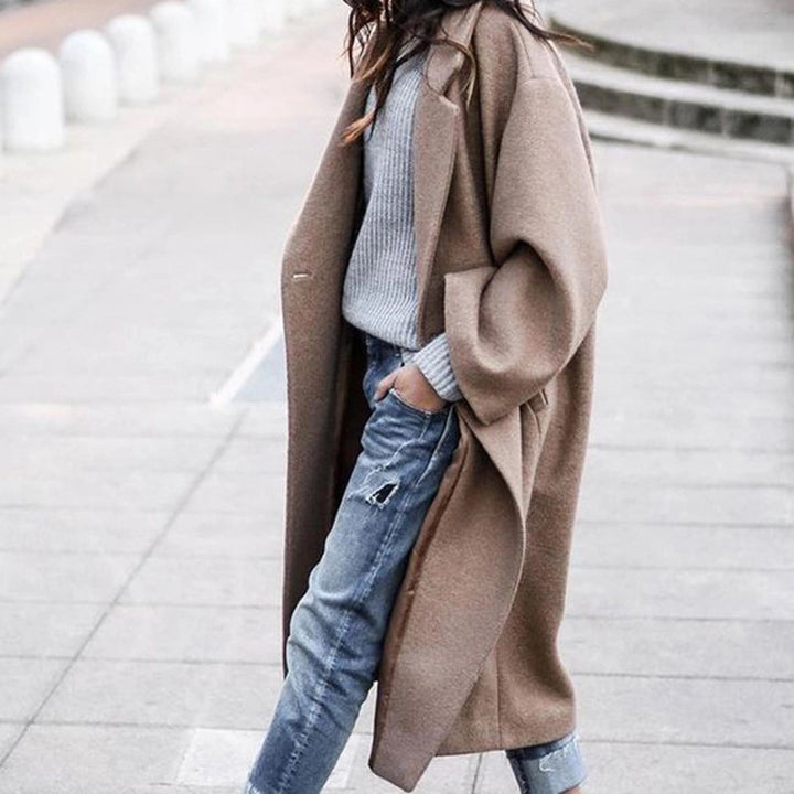 Woman wearing long oversized lapel coat