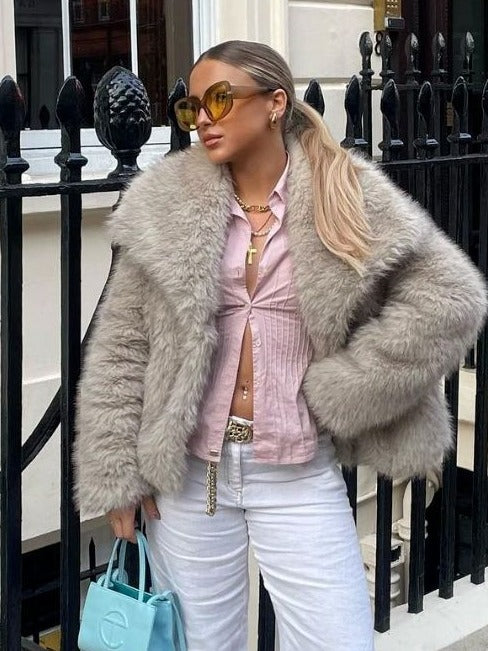 Woman in cropped fluffy faux fur jacket