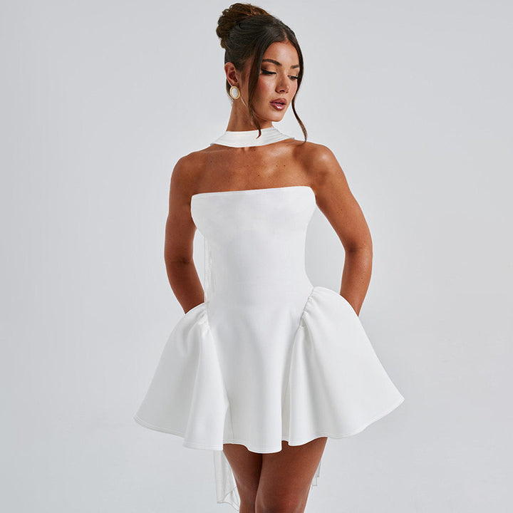 Woman in a strapless mini dress with neck scarf