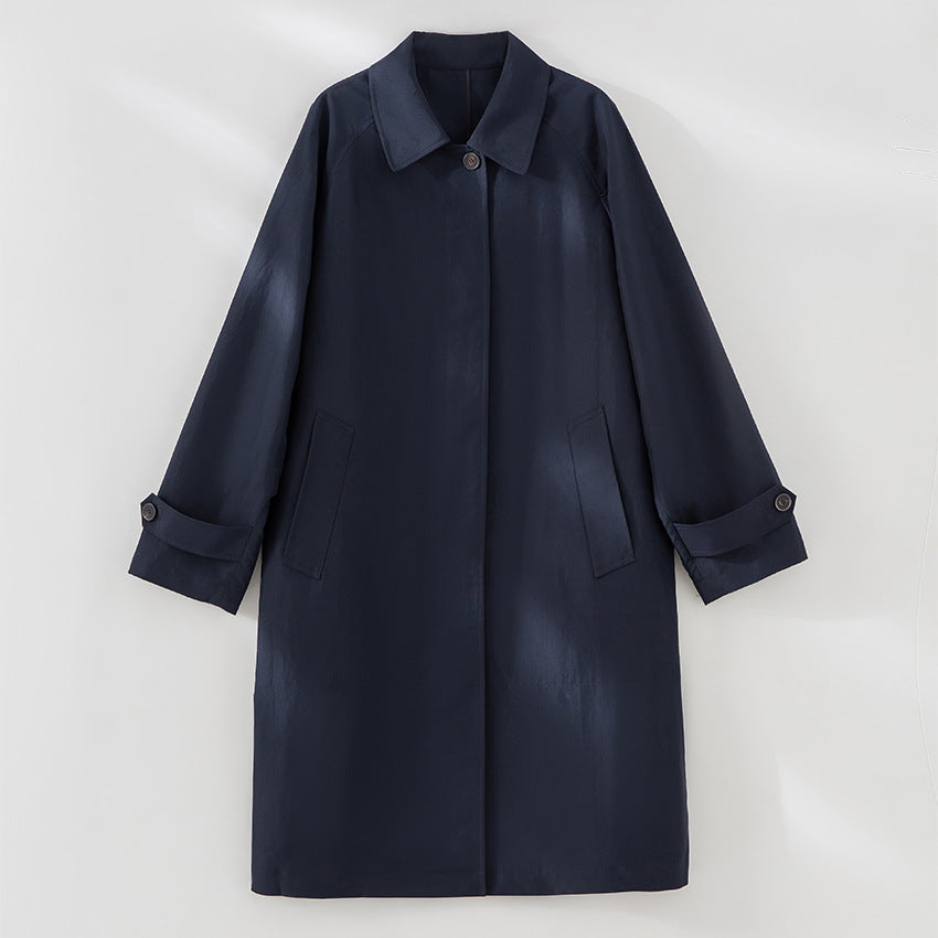 Women Longer minimalist trench coat with concealed button placket and adjustable cuffs