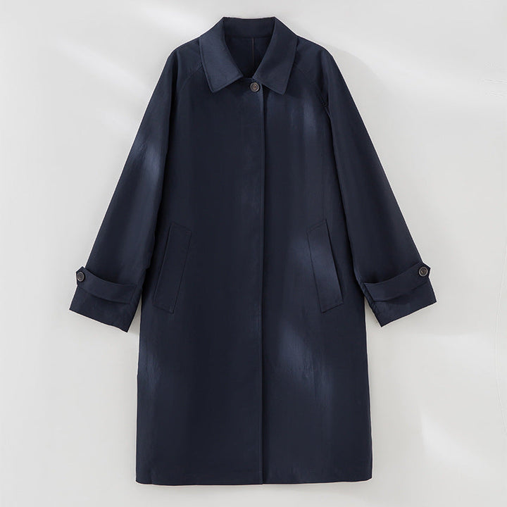 Women Longer minimalist trench coat with concealed button placket and adjustable cuffs