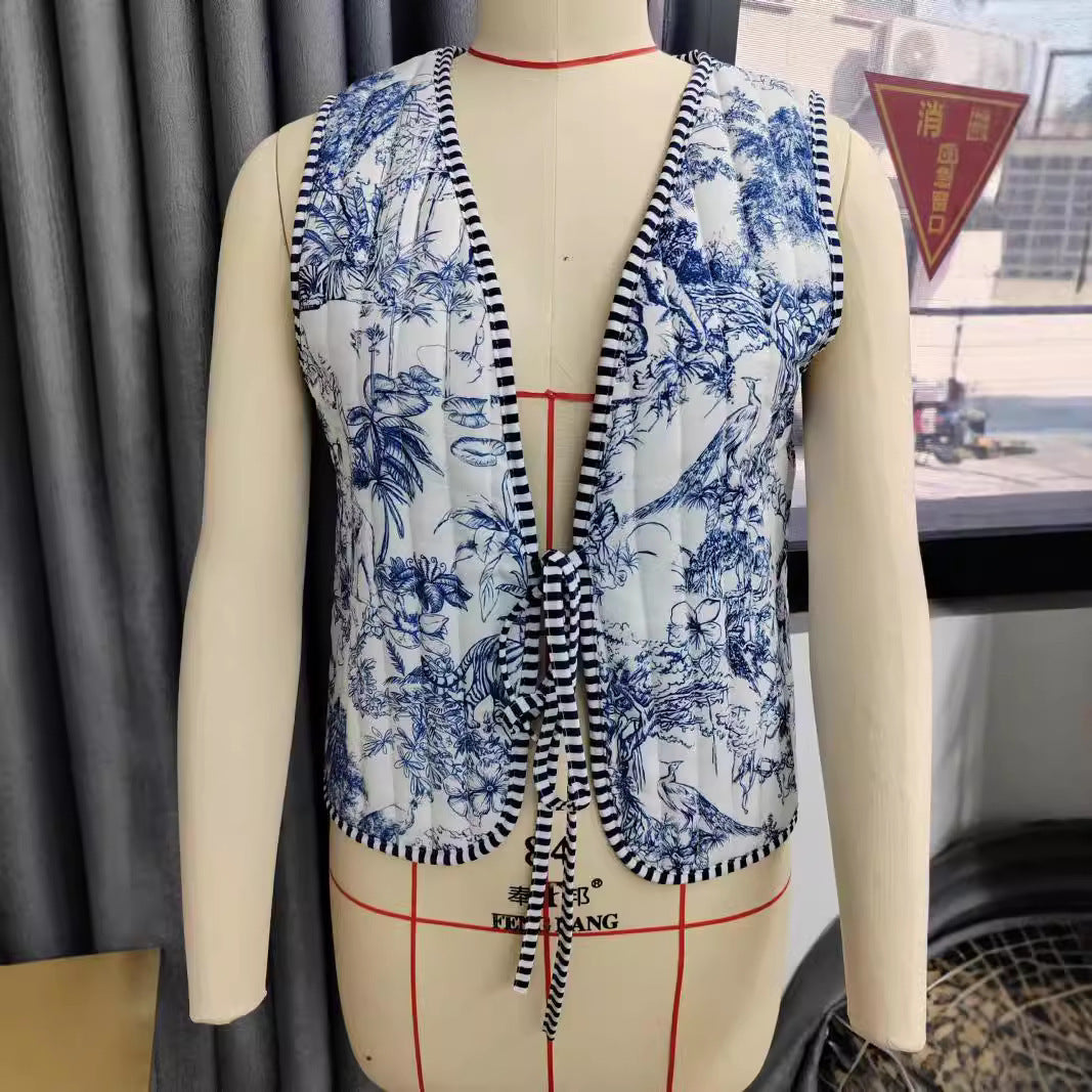 Ladies patchwork vest with tie belt, striped interior finish and contrast piping