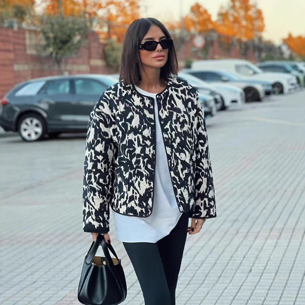 Women’s quilted jacket in oversized boxy cut with round neckline and abstract animal print