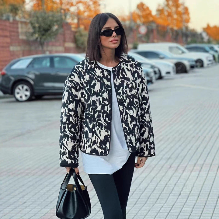 Women’s quilted jacket in oversized boxy cut with round neckline and abstract animal print