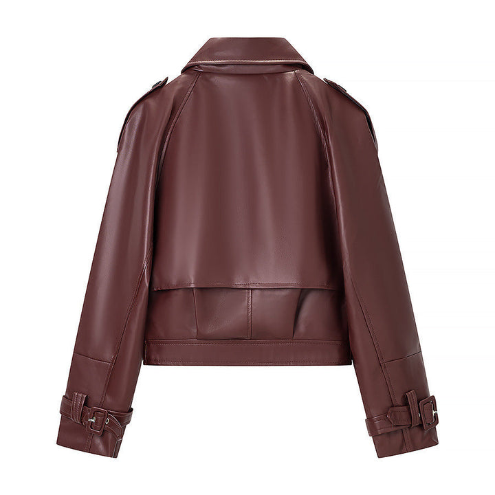 Women short cut biker jacket in leather look with asymmetrical lapel and waist belt