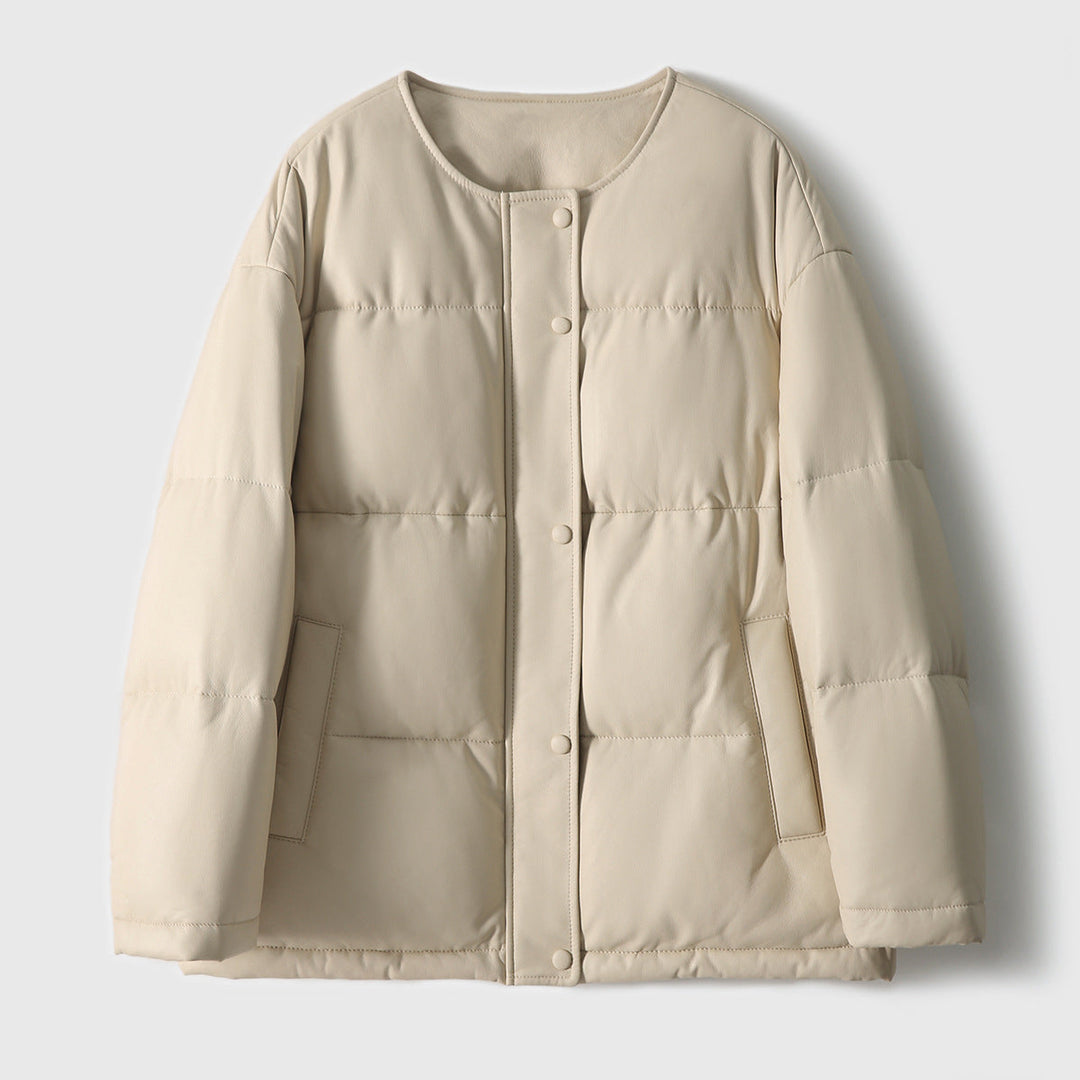 Women short cut padded faux leather jacket with round hem and snap-button placket