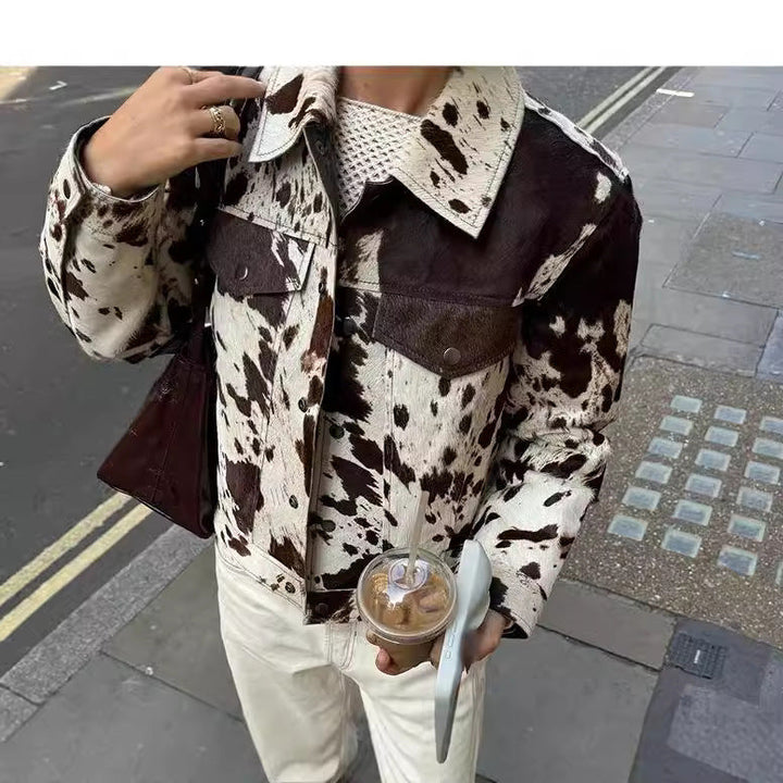 Women Short Cut Western-Inspired Jacket with Cow Spot Faux Fur and Chest Pockets