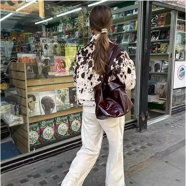 Women Short Cut Western-Inspired Jacket with Cow Spot Faux Fur and Chest Pockets