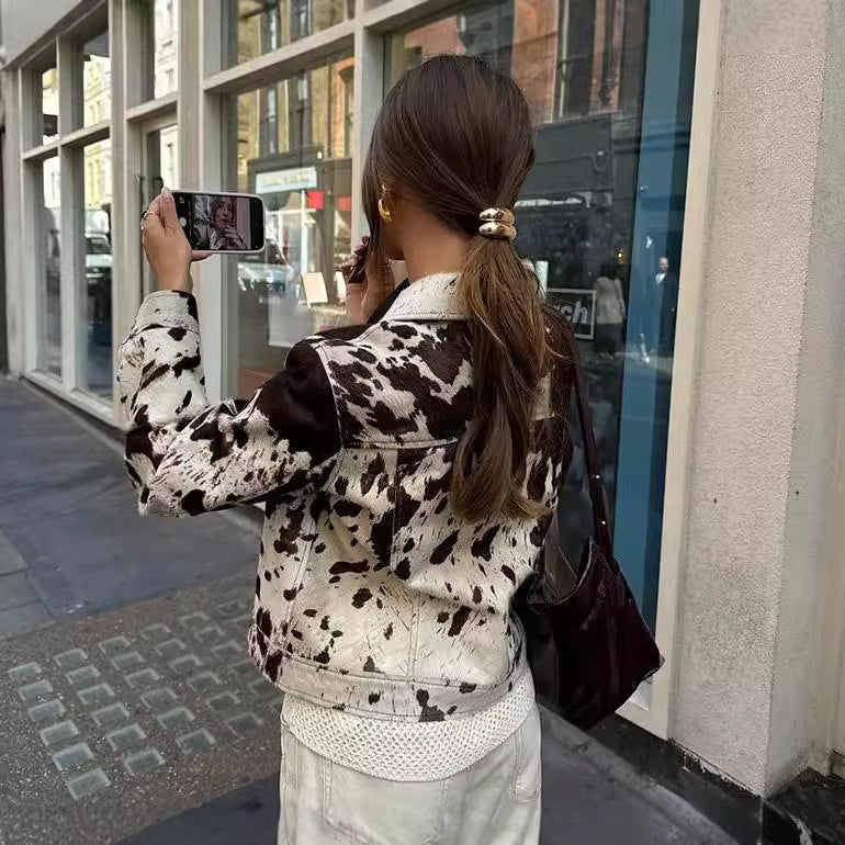 Women Short Cut Western-Inspired Jacket with Cow Spot Faux Fur and Chest Pockets