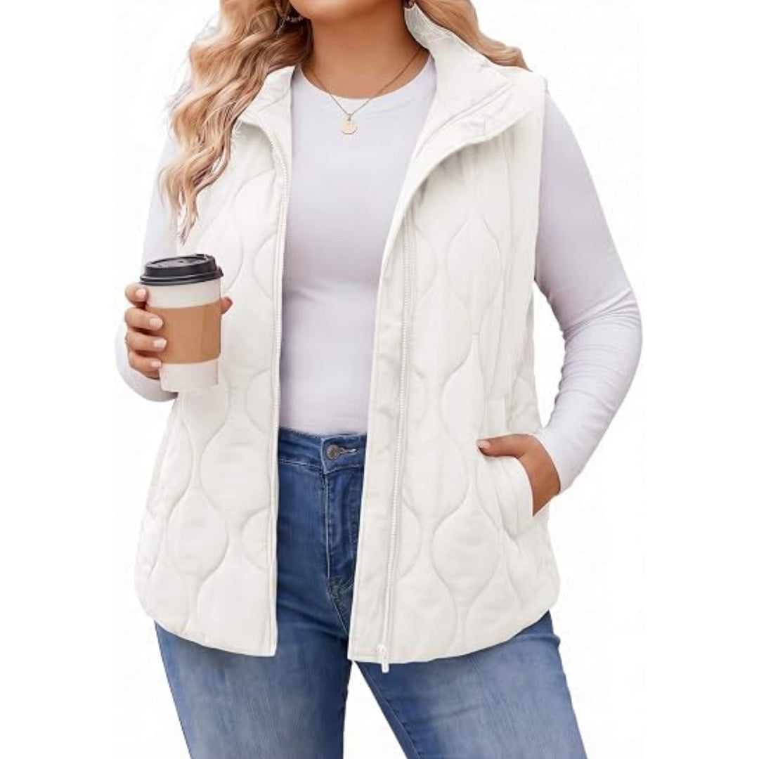 Ladies quilted vest with high collar, figure-flattering silhouette and side pockets