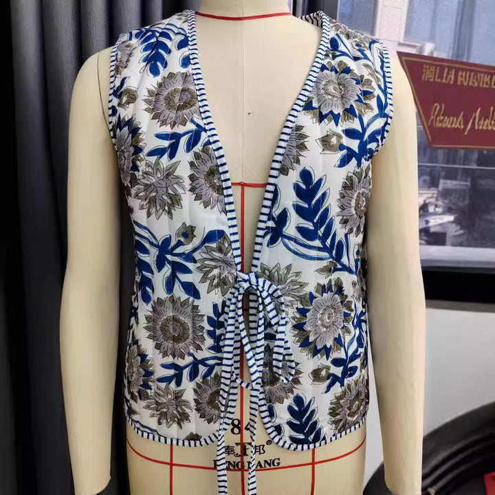Ladies patchwork vest with tie belt, striped interior finish and contrast piping