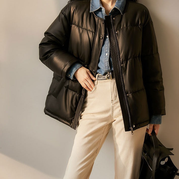 Women short cut padded faux leather jacket with round hem and snap-button placket