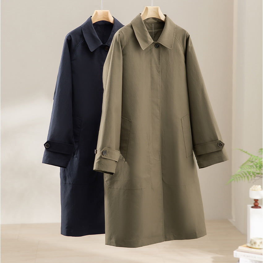 Women Longer minimalist trench coat with concealed button placket and adjustable cuffs