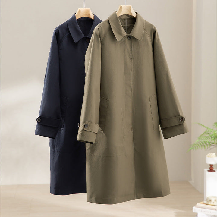 Women Longer minimalist trench coat with concealed button placket and adjustable cuffs