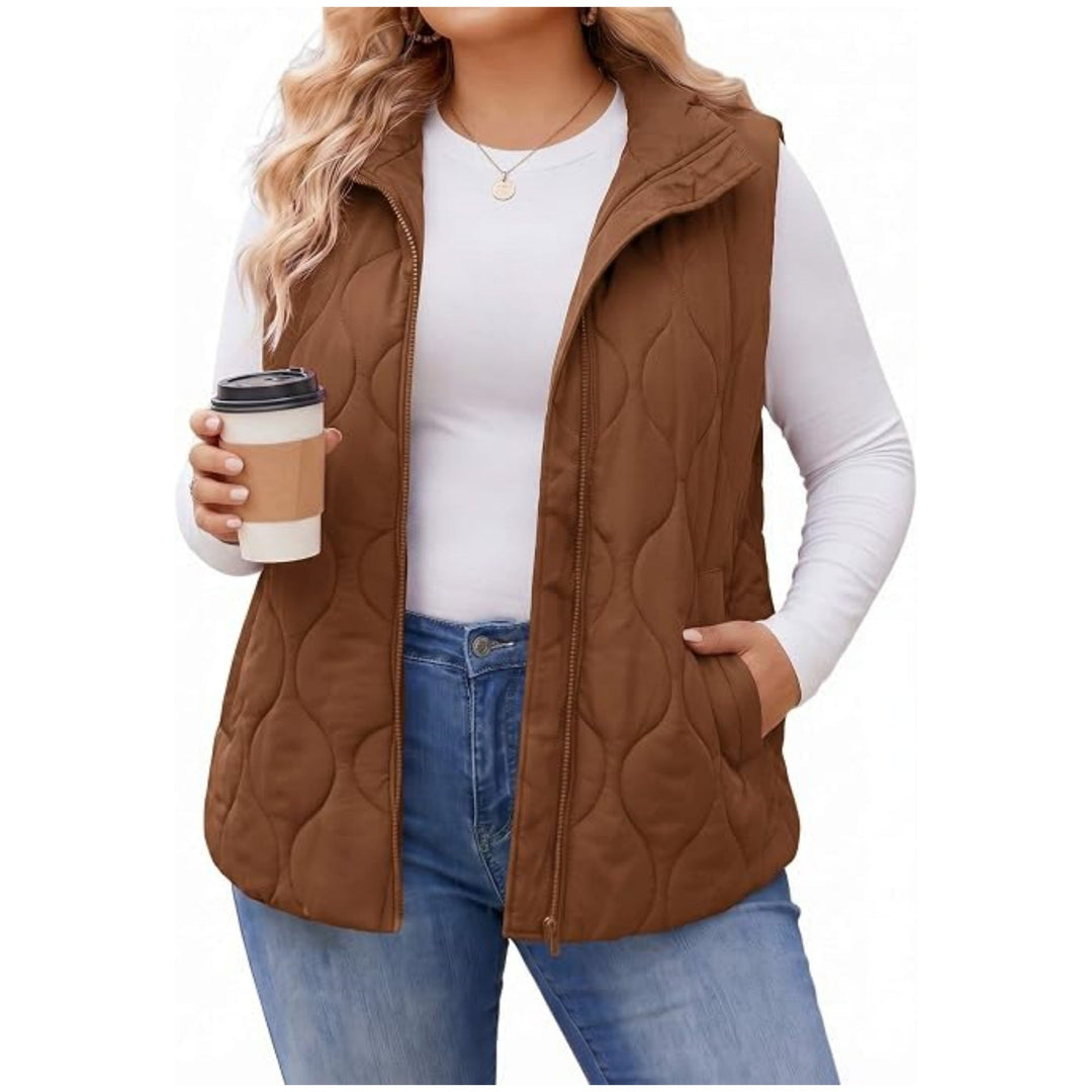 Ladies quilted vest with high collar, figure-flattering silhouette and side pockets