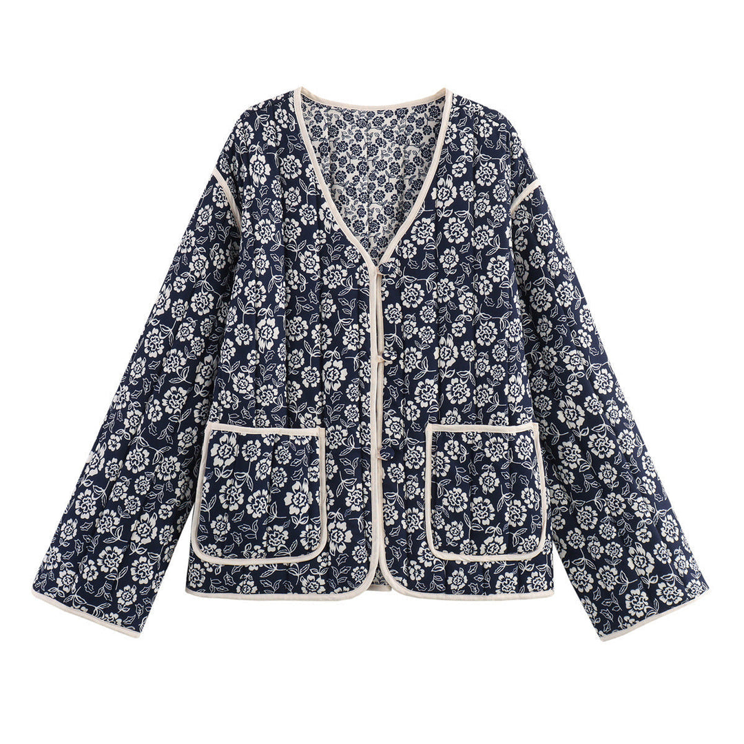 Ladies quilted jacket with floral allover, V-neck, contrast piping and patch pockets