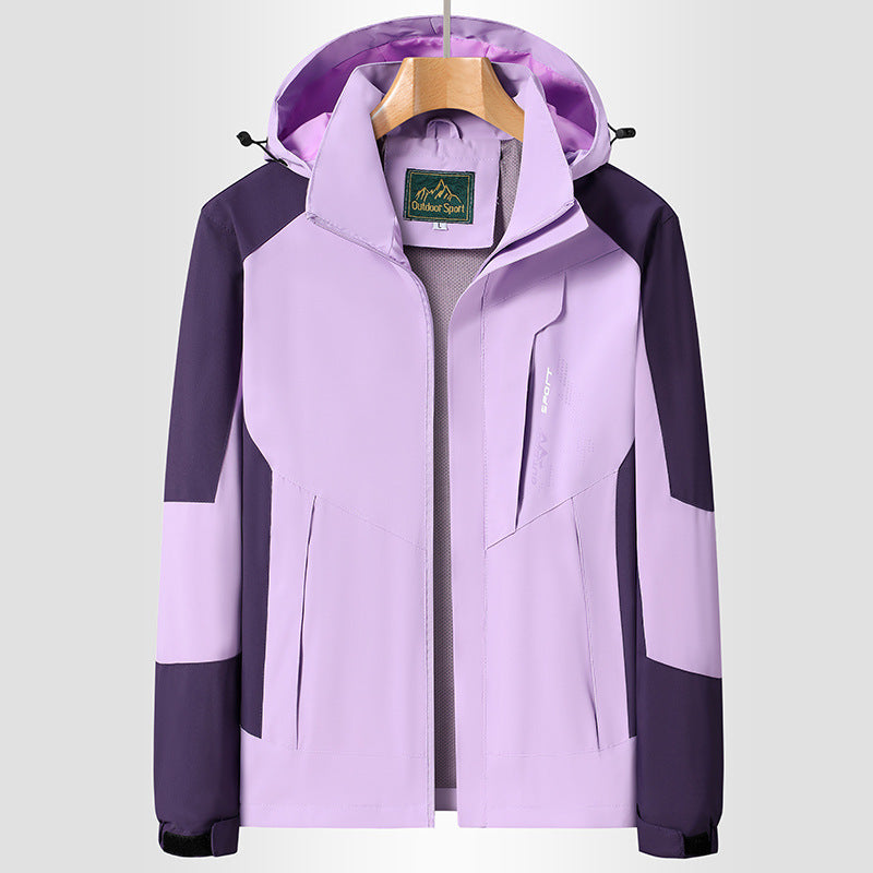 Women Softshell Trekking Jacket with breathable membrane, adjustable hood and colorblock design