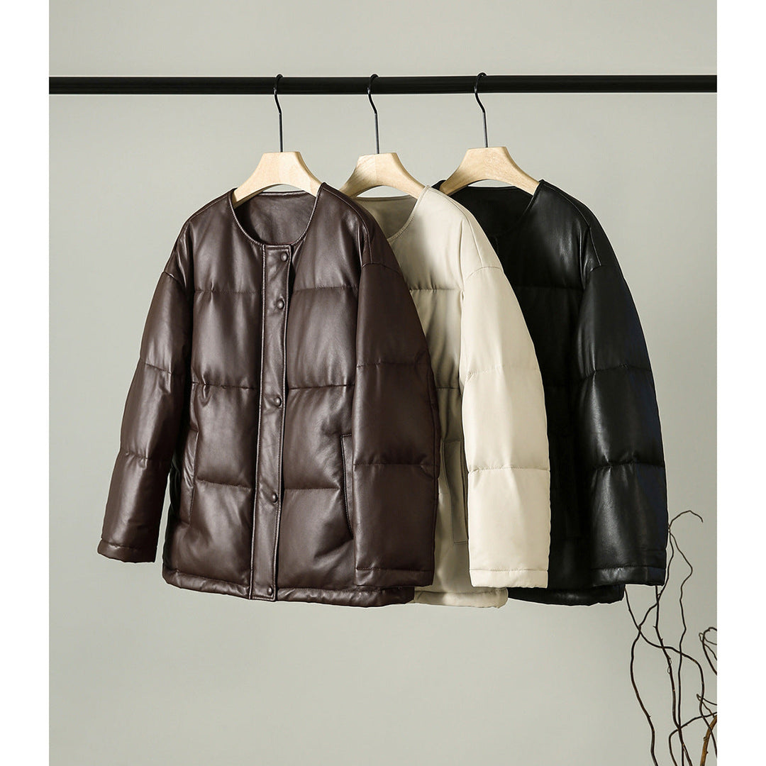 Women short cut padded faux leather jacket with round hem and snap-button placket