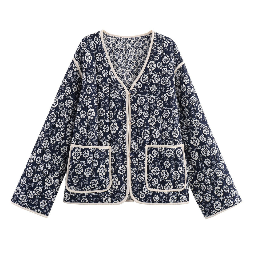 Ladies quilted jacket with floral allover, V-neck, contrast piping and patch pockets
