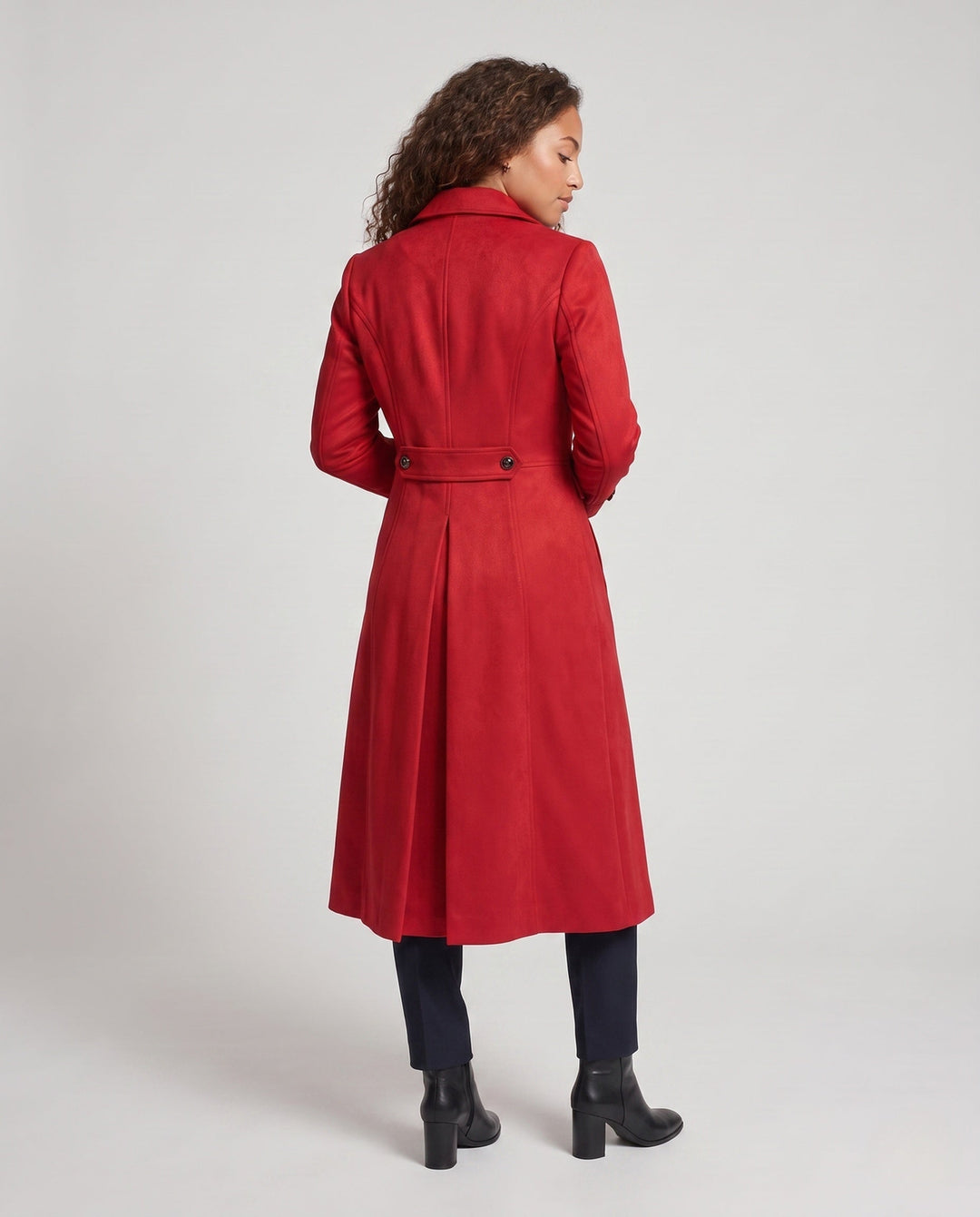 Women’s long coat with elaborate buttons and elegant silhouette
