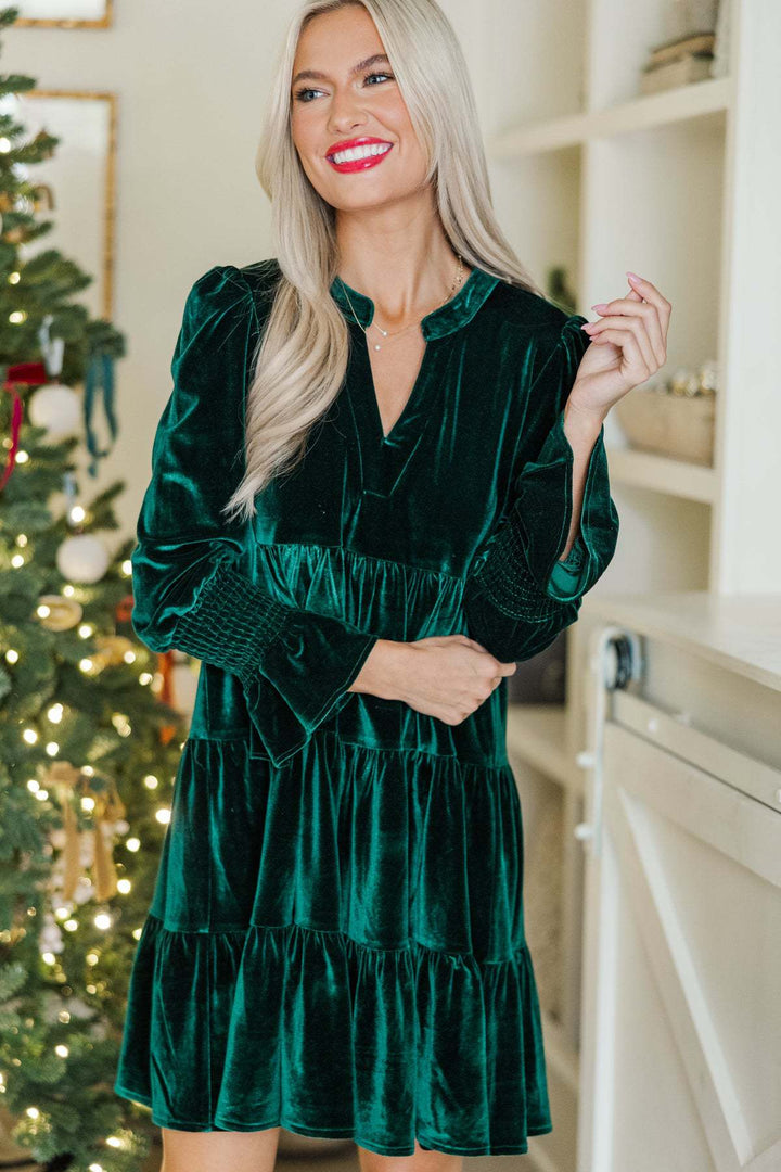 Woman in a velvet tiered mini dress