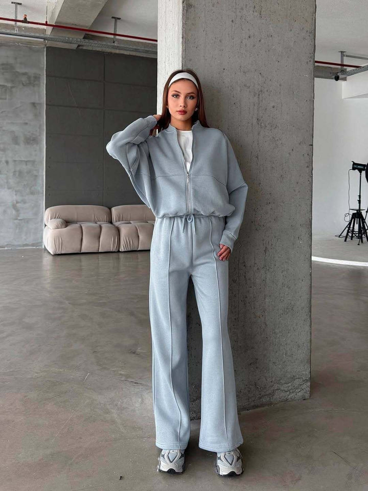 Woman in a zip jacket and wide-leg trousers set