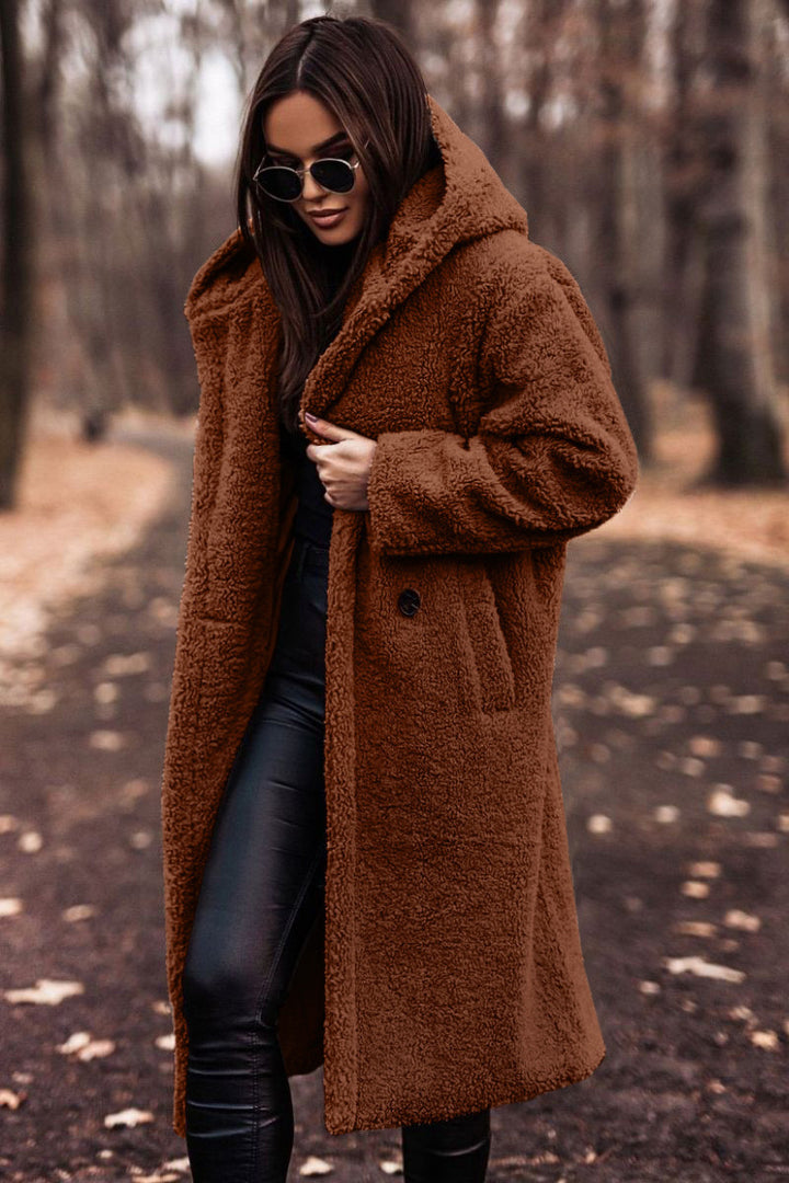 Woman in long hooded teddy coat