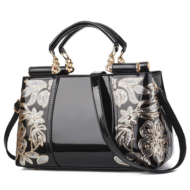 Sequin embroidered patent evening handbag