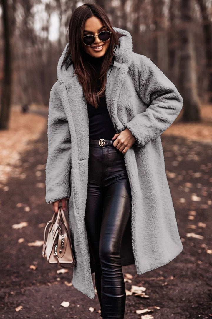 Woman in long hooded teddy coat
